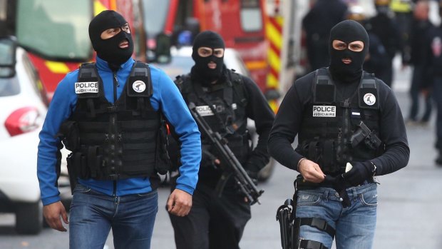 Police during the Saint-Denis operation on the outskirts of Paris on Wednesday. 