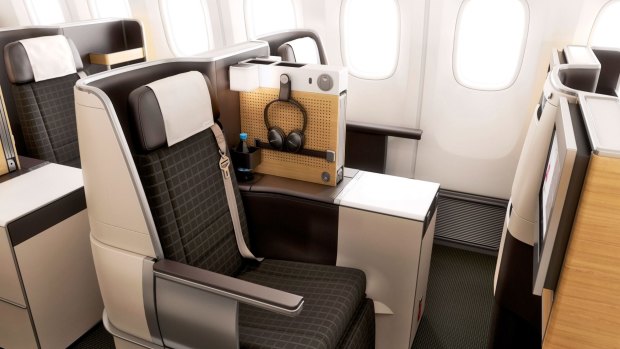 Business-class seats on Swiss International Air Lines'
Boeing 777-300ERs are flatbed, and there's a compartment for shoes and a drawer beneath the TV screen for other items.