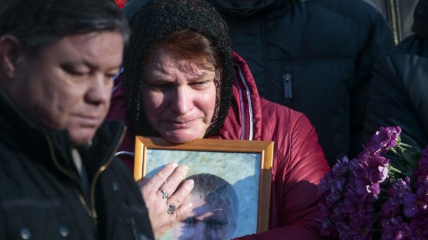 Maria, the mother of Alexei Alekseyev, at his funeral  in St Petersburg on Thursday. 