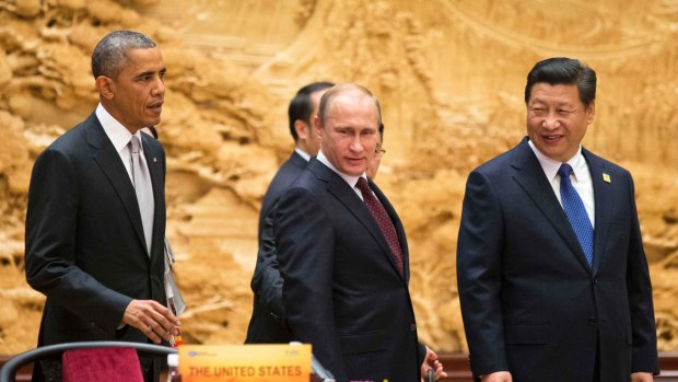 US President Barack Obama and his Russian and Chinese counterparts, Vladimir Putin and Xi Jinping, at the APEC summit in 2014.