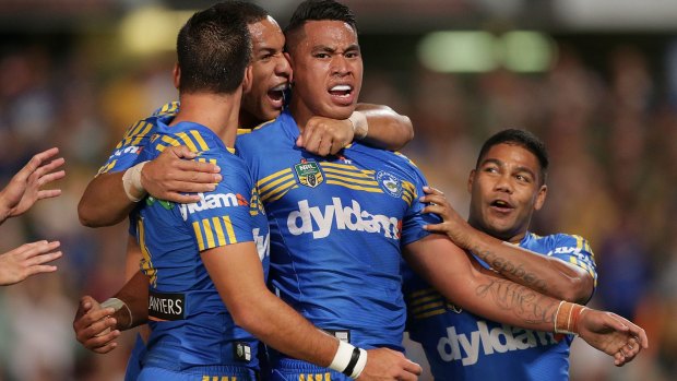 Making a name for himself: Eels winger John Folau celebrates after scoring the first of his two tries.