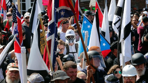 White nationalist demonstrators are surrounded by counter demonstrators in Charlottesville.