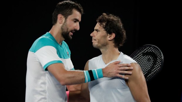 Marin Cilic advanced to the semi-finals of the Australian Open on Tuesday after top seed Rafael Nadal retired hurt.