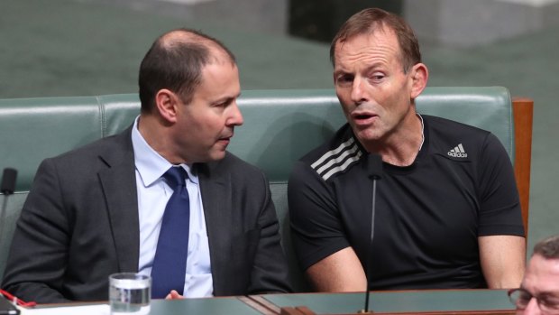 Energy Minister Josh Frydenberg and Tony Abbott during the vote.