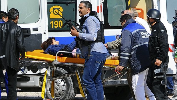 A victim is evacuated outside the Bardo Musum in Tunis.