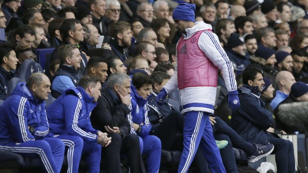 Furious: Diego Costa storms back to the Chelsea bench after not being used as a substitute.