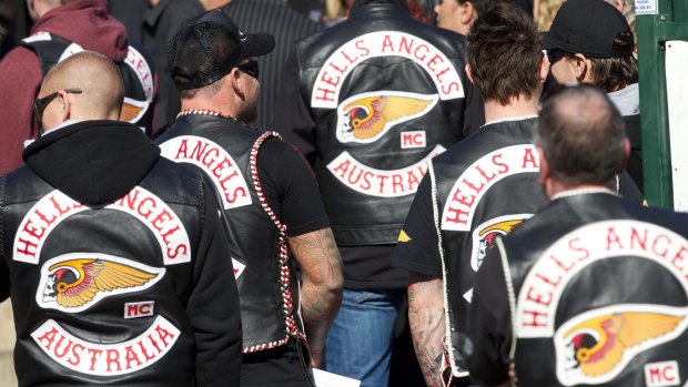 Hell's Angels wearing jackets with the club's trademarked death head insignia. 