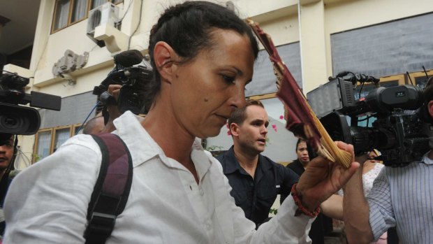 Sara Connor leaves Denpasar District Court on Monday after being sentenced to four years' jail.