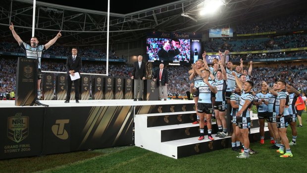 Paul Gallen and his teammates celebrate their grand final win last year.