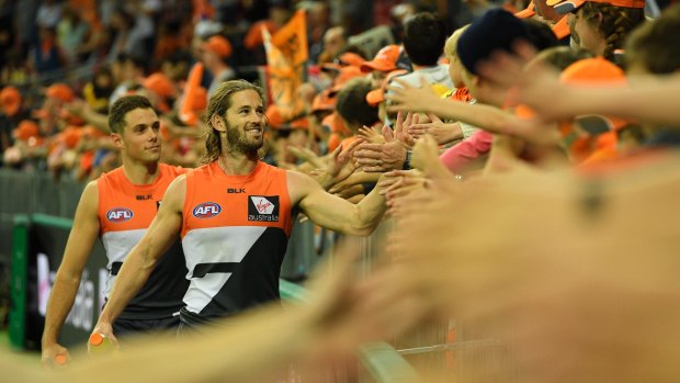 Enjoying the moment:  Callan Ward celebrates with fans after the victory in the round six AFL match between the Greater Western Sydney Giants and the Hawthorn Hawks at Spotless Stadium on April 30.