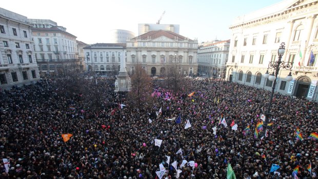People gather in Milan to support recognition of same-sex couples prior to a debate in Italian parliament.