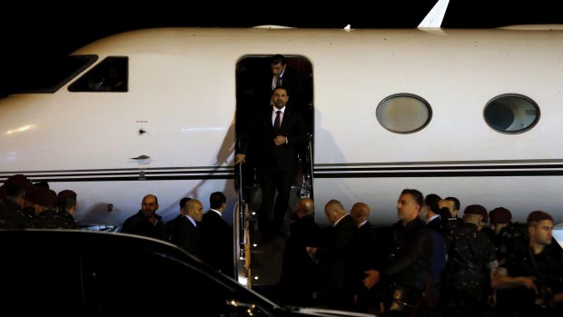 Lebanese Prime Minister Saad Hariri disembarks upon arriving at the Rafik Hariri International Airport in Beirut on Tuesday.