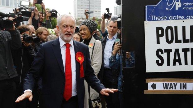 Britain's Labour party leader Jeremy Corbyn gestures after voting in London.