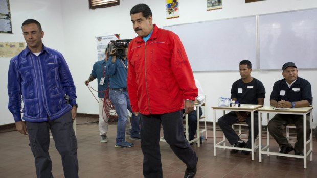 Venezuelan President Nicolas Maduro arriving at a polling station to vote. 