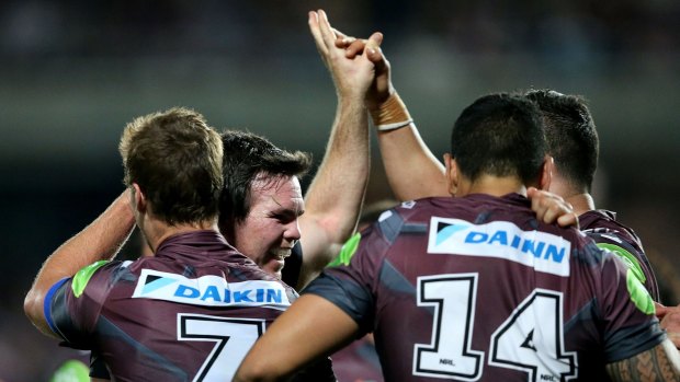 Shock win: Jamie Lyon and Manly teammates  during the win over the Brisbane Broncos at Central Coast Stadium.