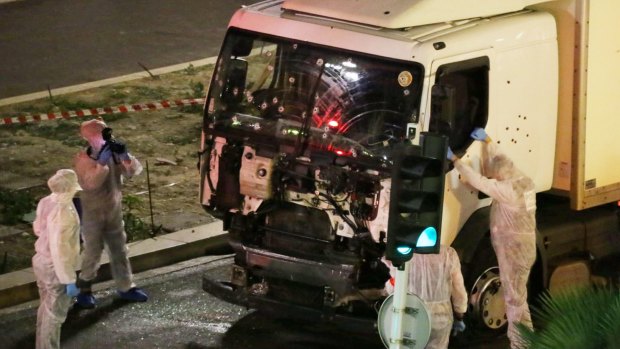 Authorities investigate a truck after it plowed through Bastille Day revellers in Nice, France,on Thursday evening.