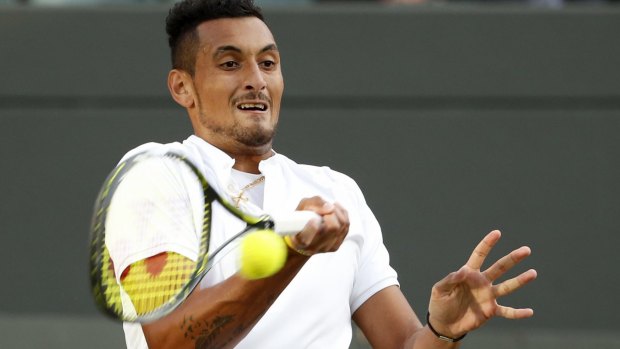 In strife yet again: Nick Kyrgios returns to Feliciano Lopez during their men's singles match on day six of Wimbledon.