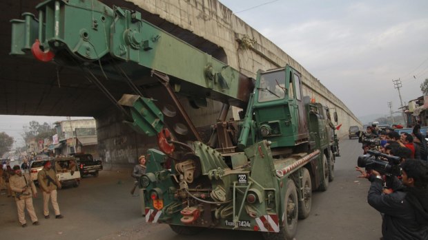 An Indian army truck carrying military equipment moves towards the Indian air force base in Pathankot on Monday. 