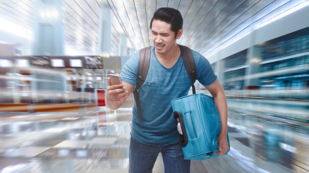 Young asian tourist rushing to boarding a plane on the departure area