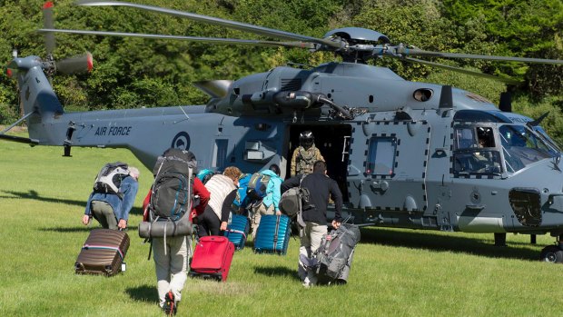 Tourists are evacuated by helicopter from Kaikoura, NZ, following the November 14 earthquake.