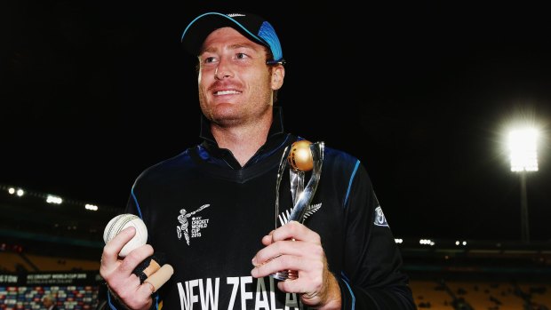Martin Guptill of New Zealand holds the player of the match trophy after the quarter-final against the West Indies.