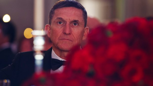 Michael Flynn listens during the presidential inaugural Chairman's Global Dinner on January 17.