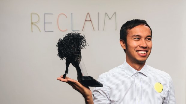 Couture trashion artist Francis Sollano from the Philippines with a shoe, one of the pieces he has on show in the Reclaim exhibition as part of Design Canberra.