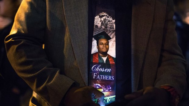 An image of Michael Brown, who was killed by the police in Ferguson, Missouri, on the tie of his father, Michael Brown senior.