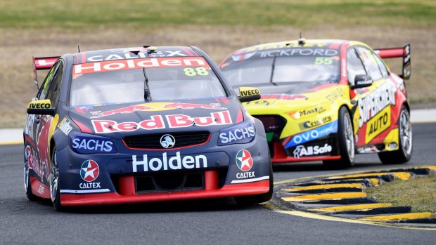 Full camber: Jamie Whincup of Red Bull Holden Racing leads Chaz Mostert of Supercheap Auto Racing in the Red Rooster SuperSprint, race 18.
