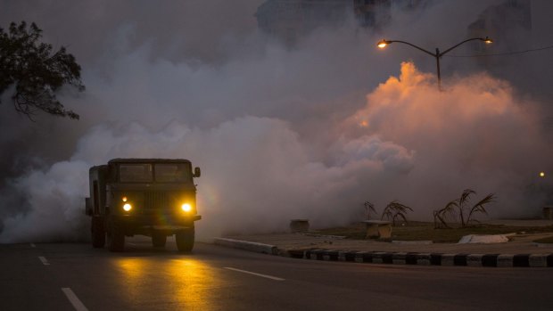 An army truck fumigates to kill mosquitos in the Vedado neighbourhood of Havana, Cuba, on Tuesday.