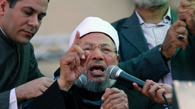 February 2011: Yusuf al-Qaradawi speaks to the crowd at Friday prayers in Tahrir Square in Cairo. 