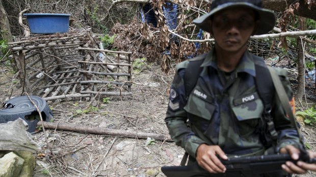 A cage made of barbed wire and bamboo sticks that Malaysian police said was used to hold migrants at an abandoned human trafficking camp in a jungle close to the Thai border.