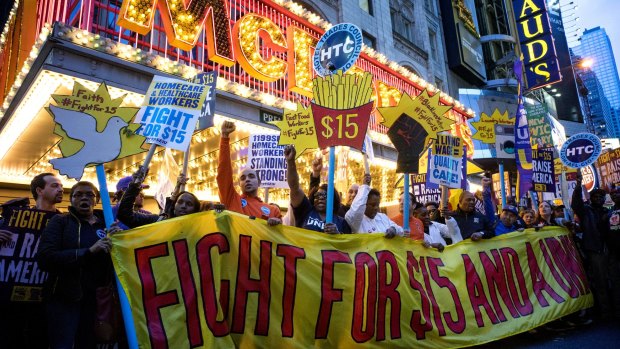 McDonalds has agreed to lift wages at company-owned stores following long-running worker protests about pay.