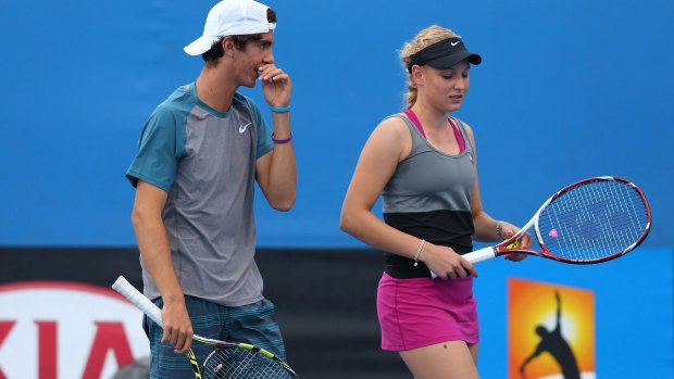 Caught in the middle: Thanasi Kokkinakis and Donna Vekic at the 2014 Australian Open.