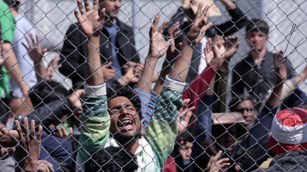 Refugees from Afghanistan and Pakistan at the detention centre in Lesbos protest against their deportation to Turkey.