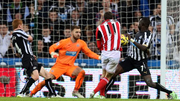 Winner: Sunderland's Adam Johnson, center, scores his goal during their English Premier League match against Newcastle United at St James' Park.