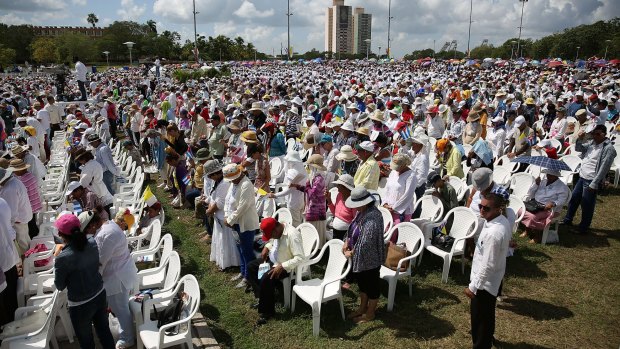 Cubans pray during Mass in the Plaza de la Revolution held by Pope Francis.
