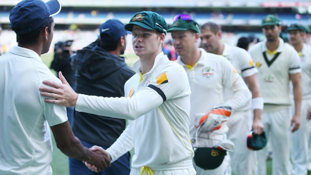 Own man: Steve Smith shakes hands with MS Dhoni after the third Test ended in a draw.