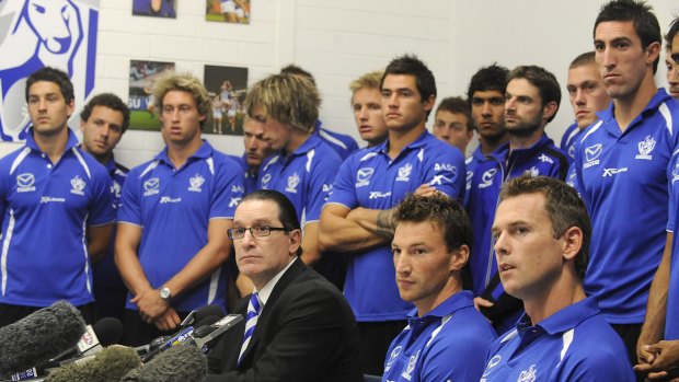 Apologetic: North Melbourne's entire playing list fronts the media in 2009.