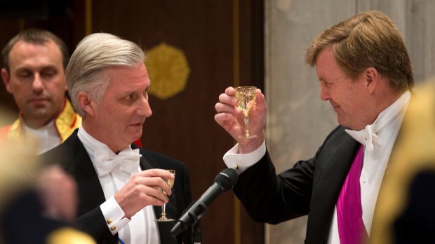 Celebrations: Dutch King Willem-Alexander, right, toasts with Belgian King Philippe at the royal palace in Amsterdam on Monday.