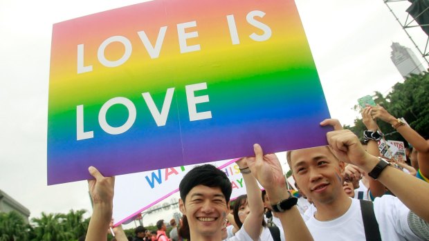 Not like mainland China: Revelers participate in a gay pride parade in Taipei, Taiwan.