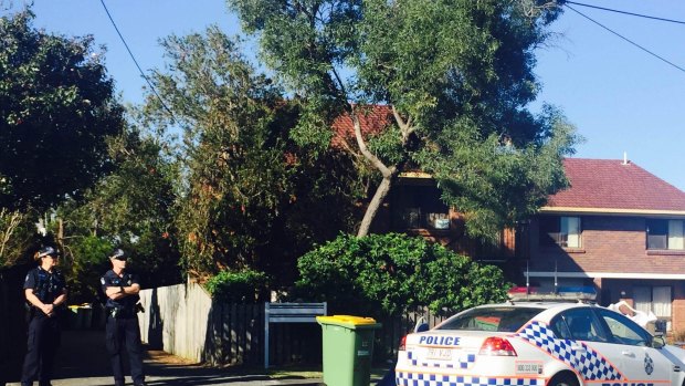 Police at the scene of a Beenleigh unit fire that cost a three-year-old boy his life on Monday night.