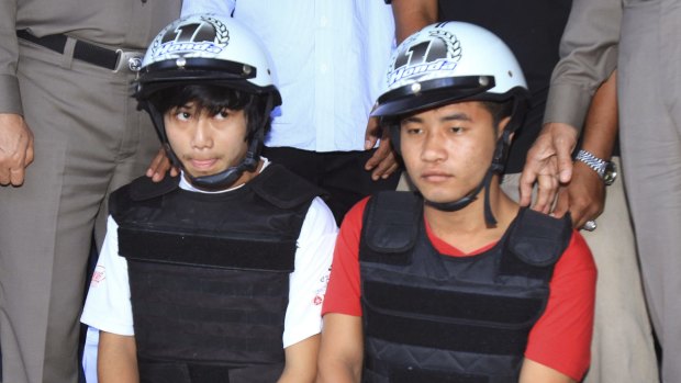 Zaw Lin, left, and Win Zaw Htun during an October 2014 police press conference after their arrest on Koh Tao, Thailand.