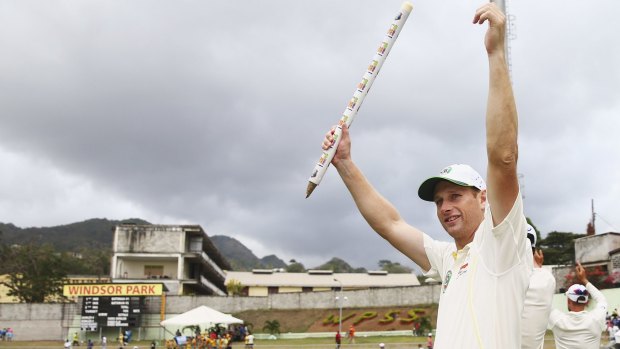 Dream debut:  Adam Voges holds aloft a stump as his team celebrated victory in the first Test against the West Indies within three days. 