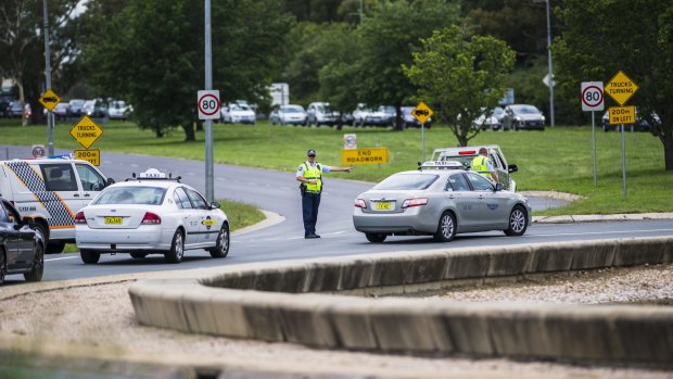  Police block off Parkes Way (going towards Queanbeyan) and Anzac Parade, due to a car crash and car fire on Wednesday afternoon.