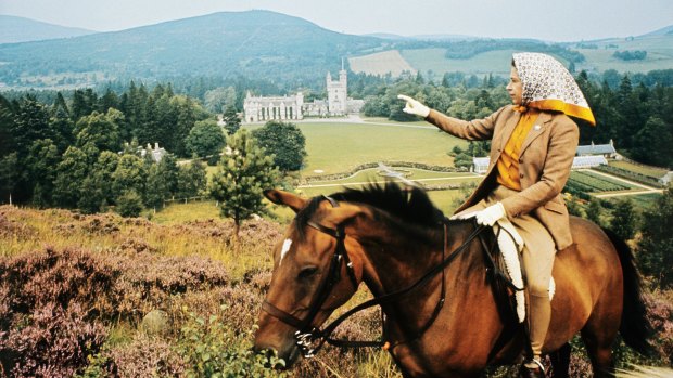 The Queen looking towards Balmoral Castle during the royal family's summer holiday in 1971.