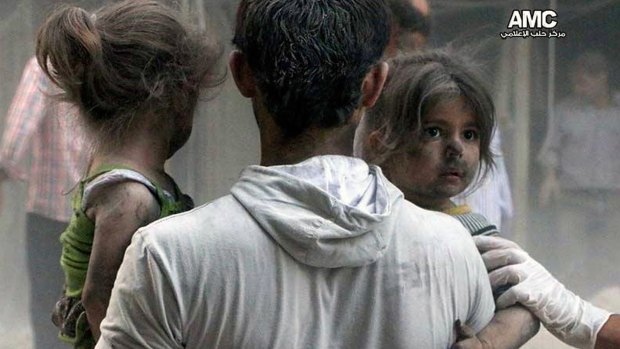 Syrian children are rescued from a building hit by a regime air strike in the Shaar district of Aleppo.