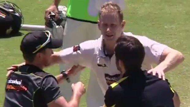 Voges is helped from the ground after being struck on the helmet by a bouncer.