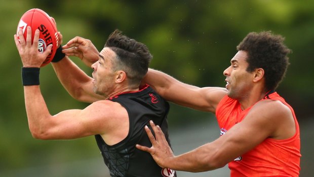 Ryan Crowley takes a mark over James Gwilt.