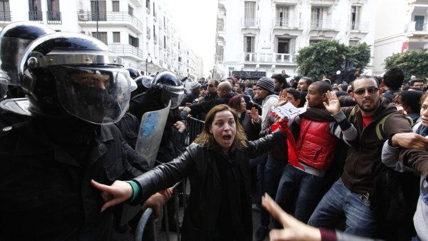 Tunisian protesters clash with riot police in 2013. 